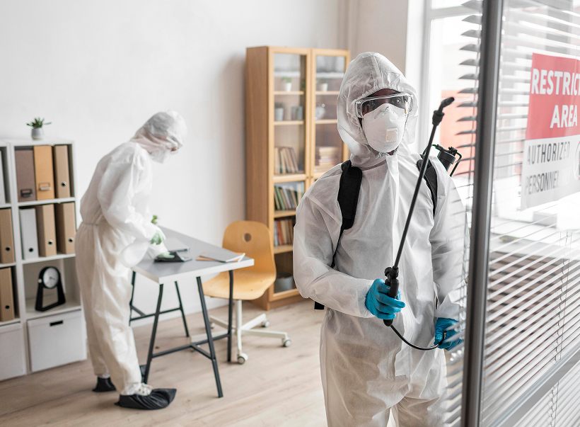 Two technicians carrying out an indoor treatment